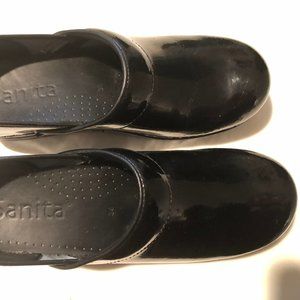 Sanita black patent leather clogs